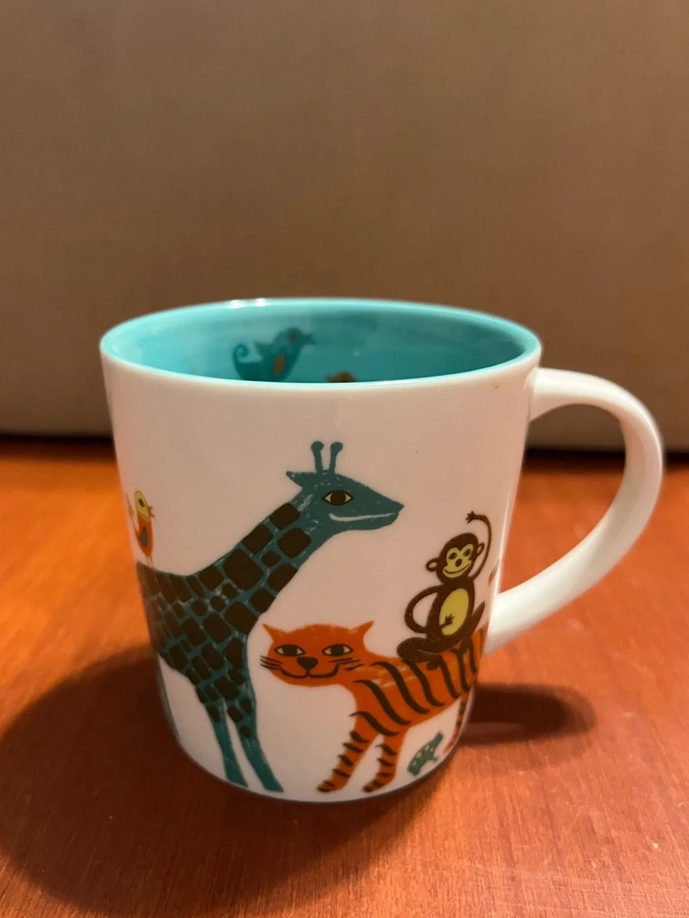 Starbucks White Mug with Teal Interior and Colorful Animal Illustrations